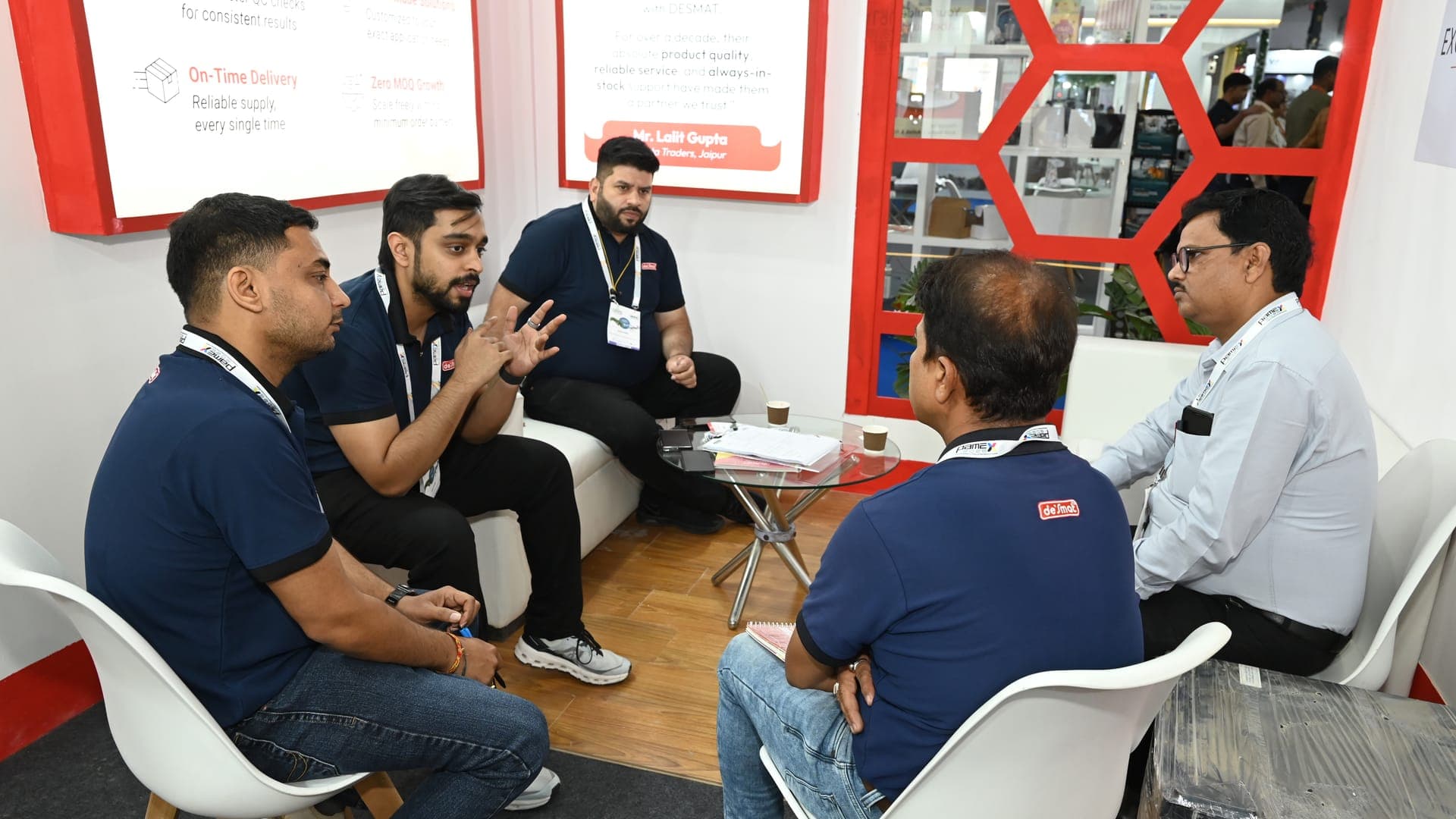 The Desmat team in discussion with business visitors at the Desmat exhibition stall