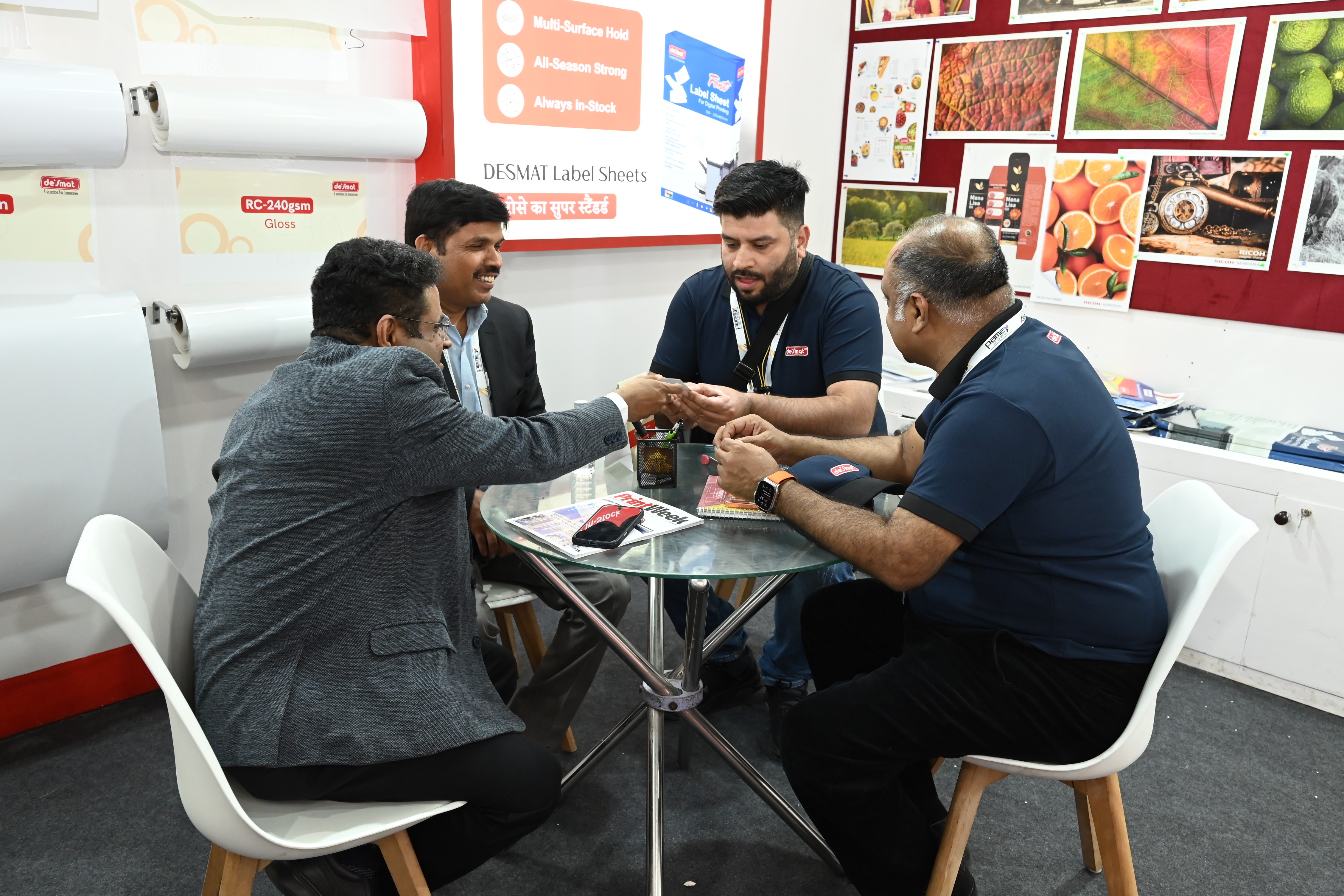 Desmat team members in discussion with visitors at the Desmat stall